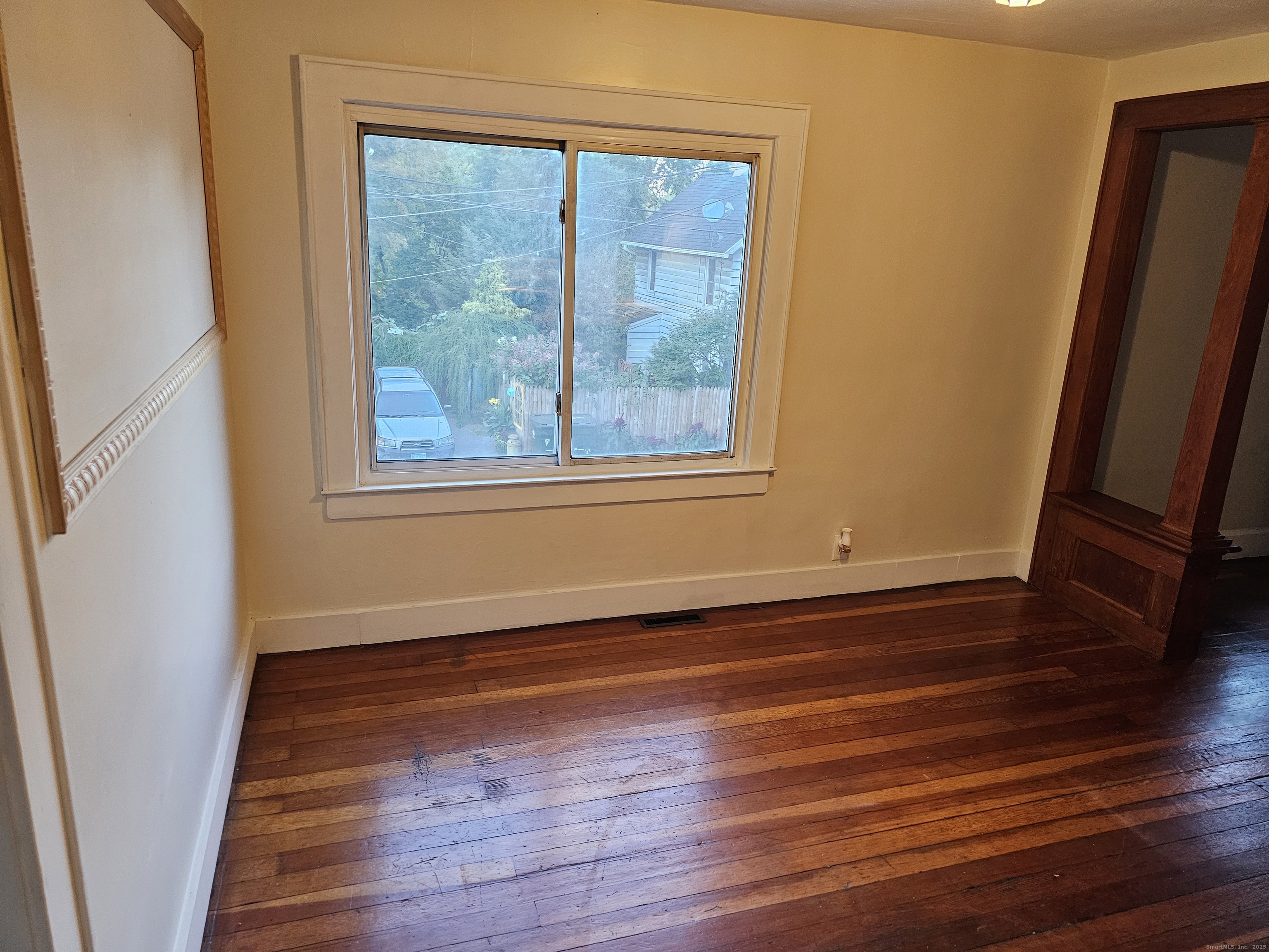 68 New Street Seymour, CT 06483 - Photo 4 of 18 a view of a room with wooden floor and window