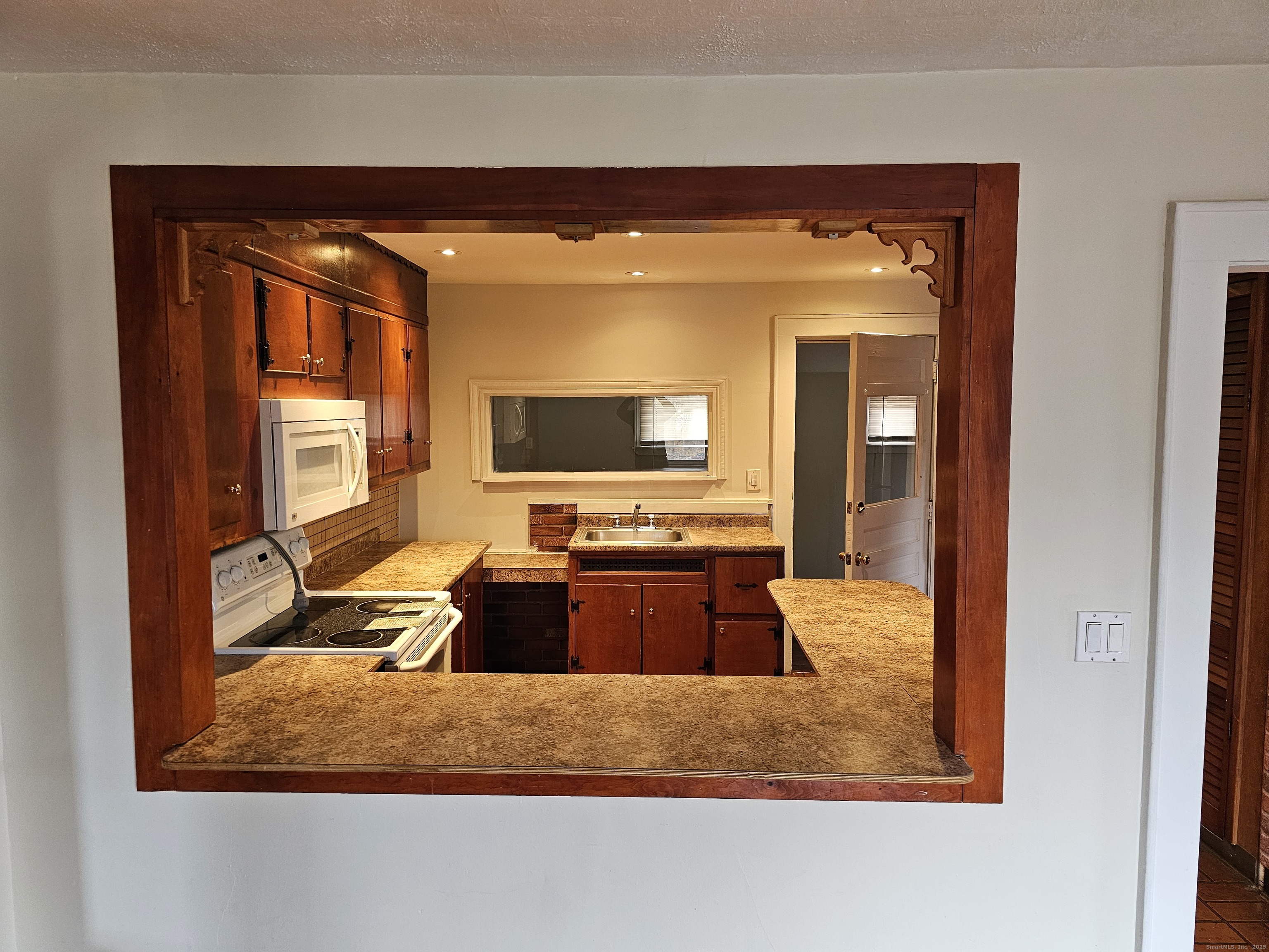 68 New Street Seymour, CT 06483 - Photo 9 of 18 a living room with furniture and a flat screen tv