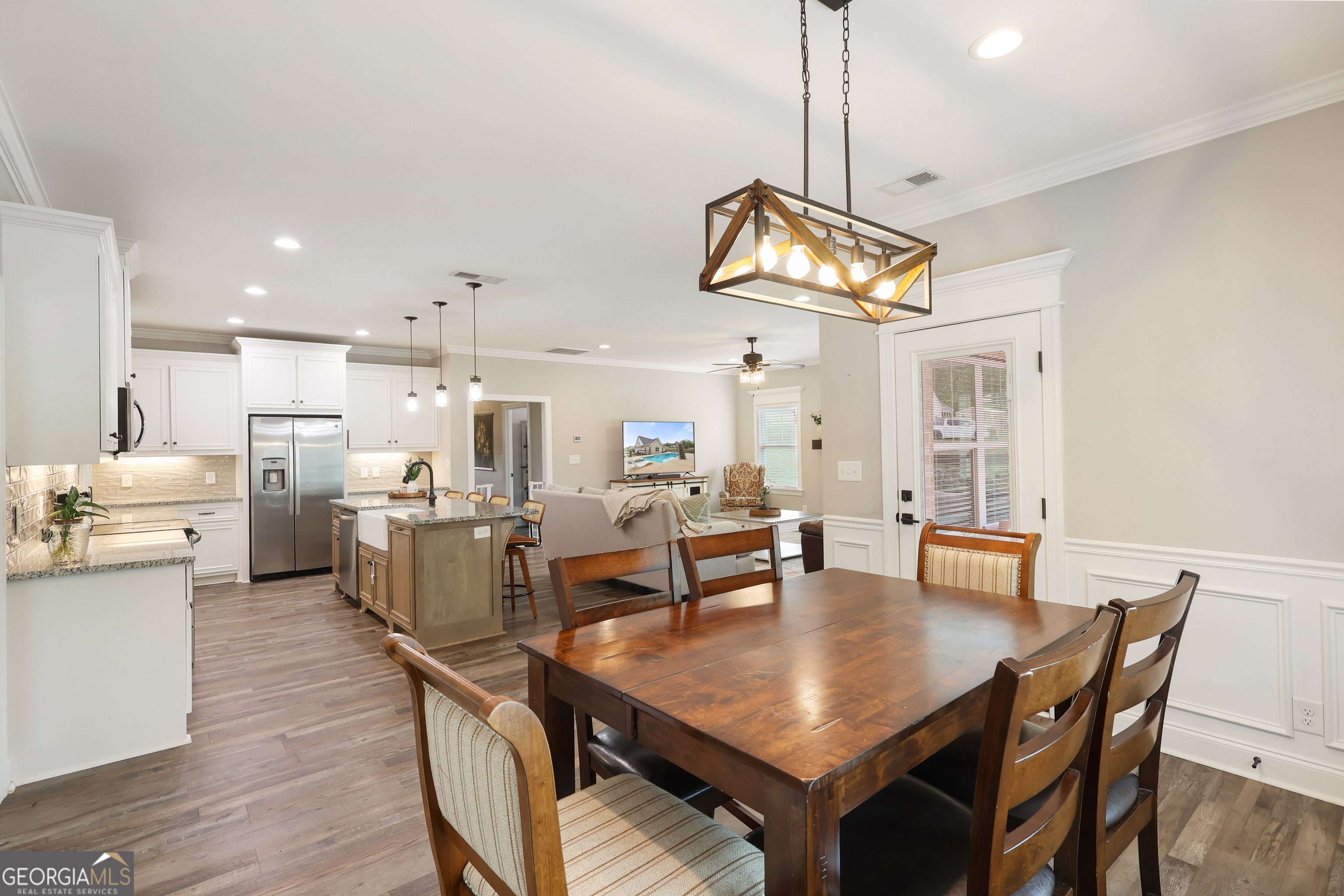 89 Claire Road Forsyth, GA 31029 - Photo 18 of 40 a view of a dining room with furniture and wooden floor
