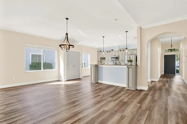 a kitchen with granite countertop a sink appliances and cabinets
