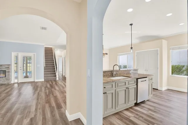 a bathroom with a double vanity sink mirror and toilet