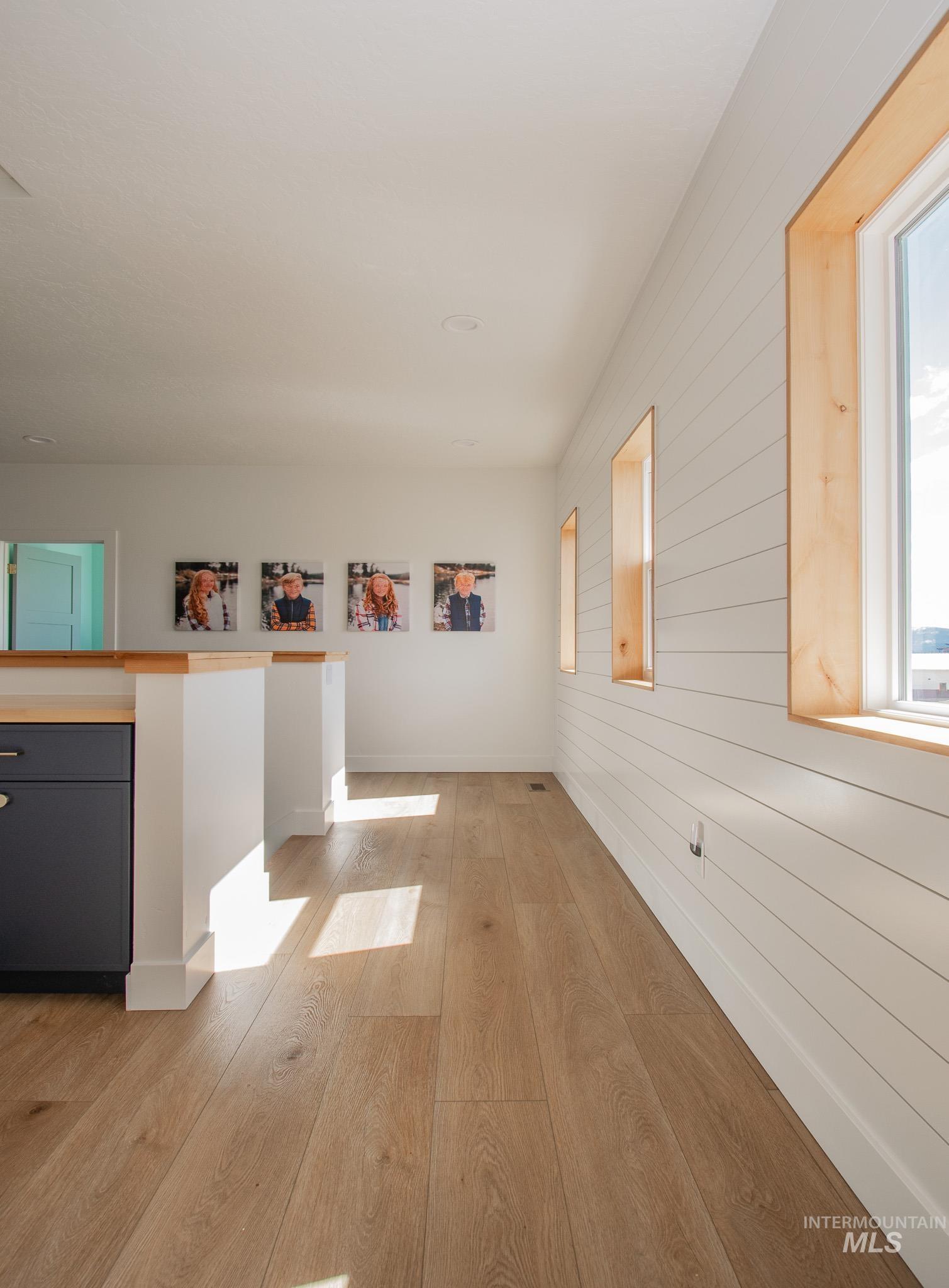 44 Big Moose Road McCall, ID 83638 - Photo 22 of 50 Wood-finish flooring throughout, complemented by a white shiplap accent wall