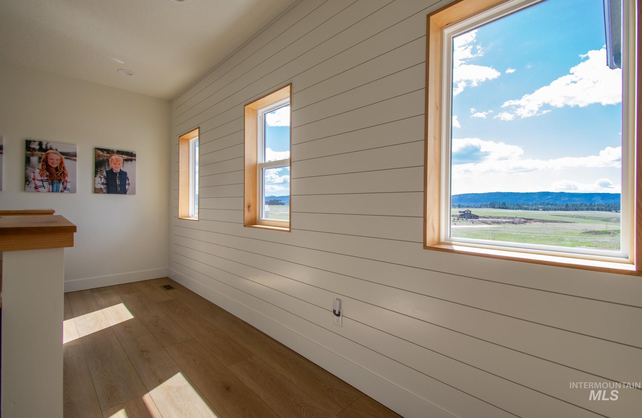 44 Big Moose Road McCall, ID 83638 - Photo 23 of 50 Light wood-finish flooring complements the horizontal plank wall paneling