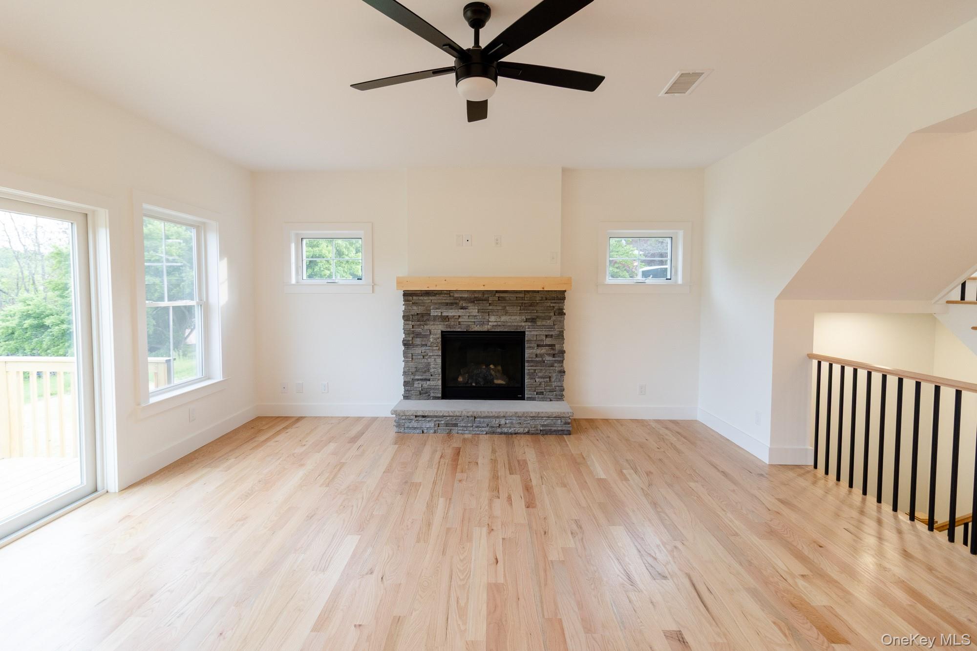 750 Ridgebury Road Slate Hill, NY 10973 - Photo 7 of 41 a view of an empty room with a window and fireplace