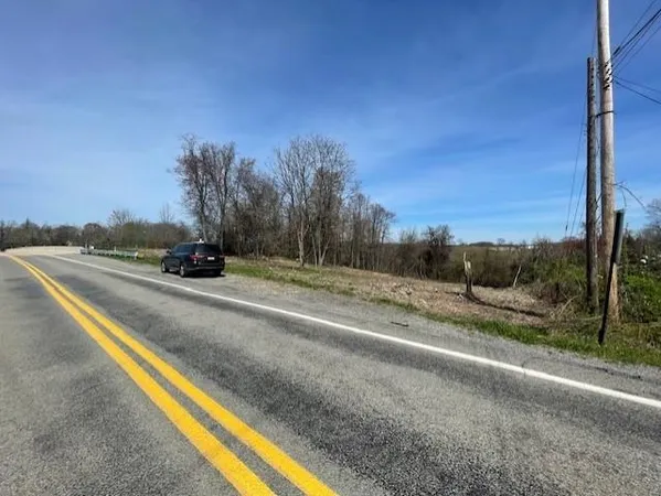 a view of a road with a building in the background