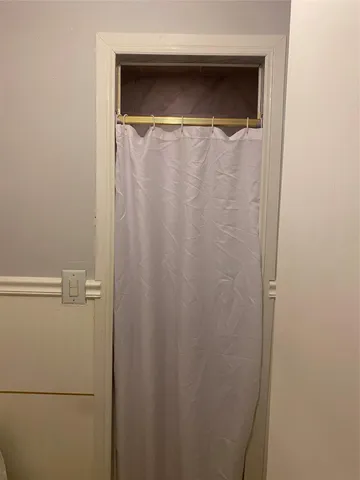 a close view of a shower in an empty room