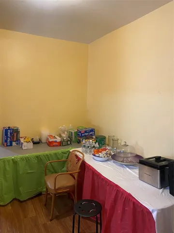 a kitchen with a table and chairs in it