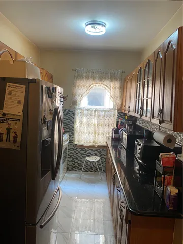 a kitchen with lots of counter top space and stainless steel appliances