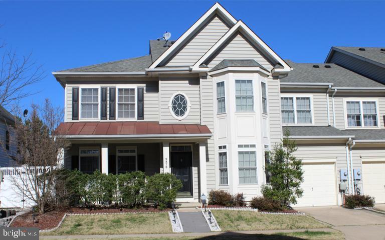 9878 Dochart Sound Lane Bristow, VA 20136 - Photo 2 of 30 a front view of a house with a yard