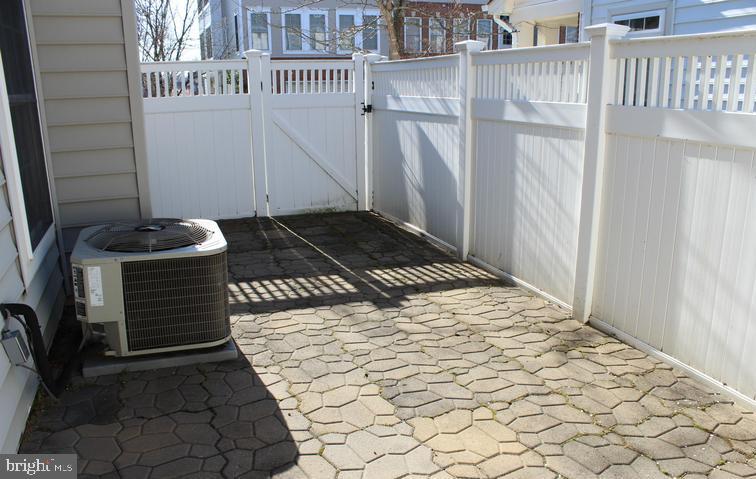 9878 Dochart Sound Lane Bristow, VA 20136 - Photo 27 of 30 a bedroom with a bed and a cabinets
