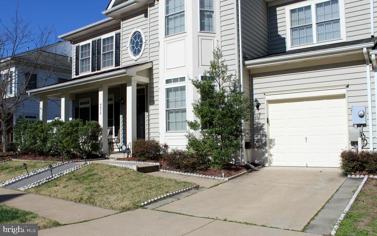 9878 Dochart Sound Lane Bristow, VA 20136 - Photo 3 of 30 a front view of a house