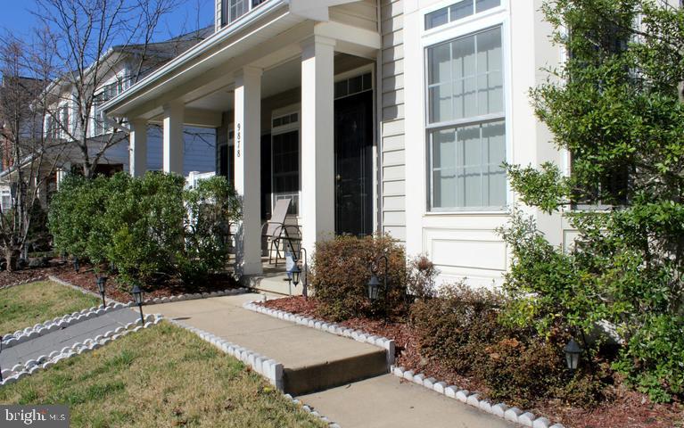 9878 Dochart Sound Lane Bristow, VA 20136 - Photo 4 of 30 a view of a building with potted plants