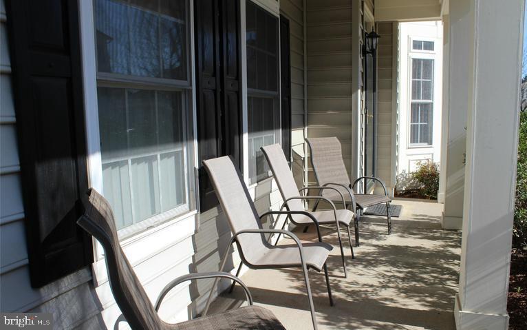 9878 Dochart Sound Lane Bristow, VA 20136 - Photo 7 of 30 a view of a balcony with table and chairs