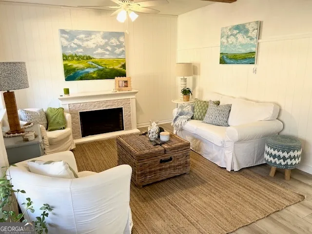 a living room with furniture and a fireplace