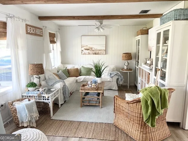 a living room with furniture and a window