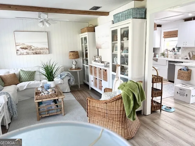 a bedroom with furniture and a large window