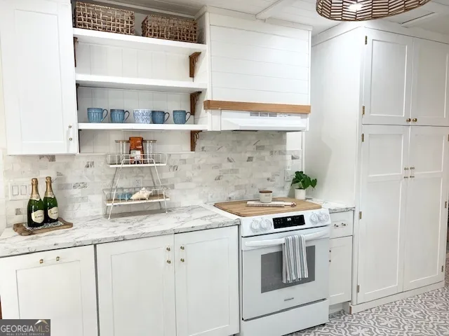 a kitchen with stainless steel appliances white cabinets and a sink