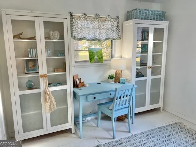 a dining room with a table and chairs