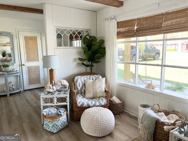 a living room with furniture and a window