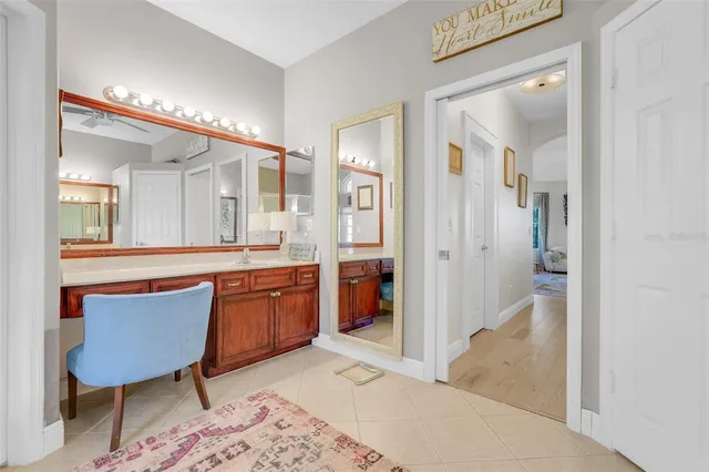 a kitchen with stainless steel appliances a stove a sink dishwasher a oven with a dining table and chairs