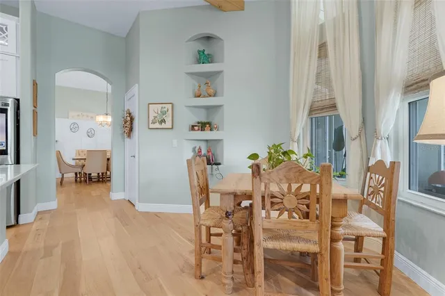 a large kitchen with kitchen island granite countertop a sink and cabinets