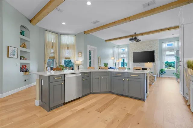 a living room with fireplace furniture and a fireplace