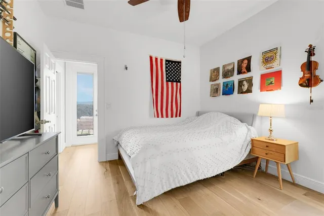 a bedroom with a bed and a chair