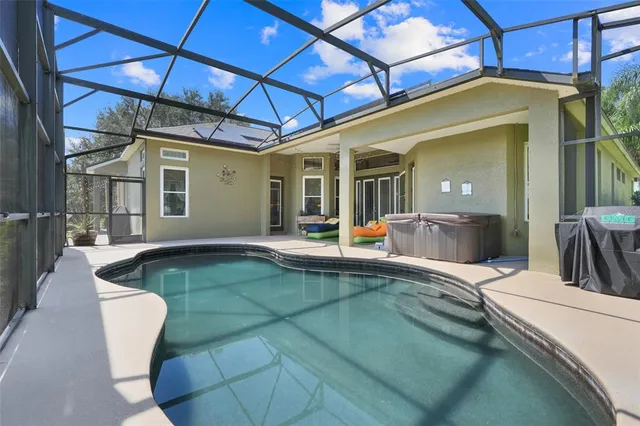 a view of a chair and tables in the patio