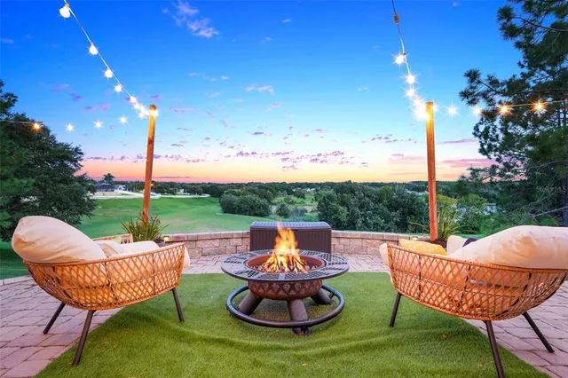 a front view of a house with a yard and a garage
