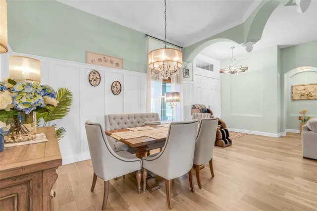 a bedroom with a bed and a flat screen tv in it