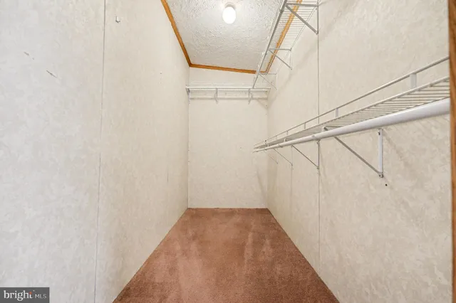 a view of a hallway with stairs