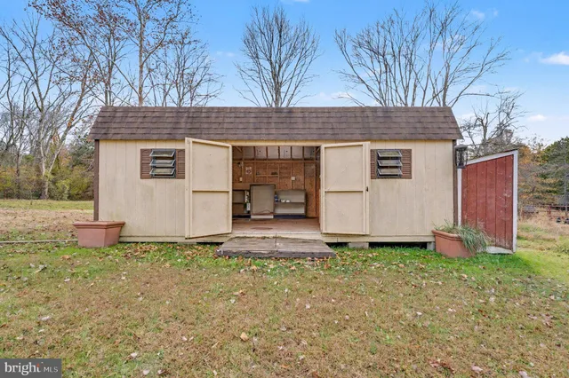 a house that has a tree in front of it