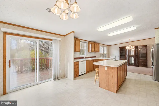 a kitchen with a stove a sink and a refrigerator