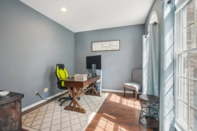 a work room with furniture and wooden floor