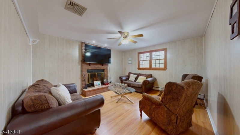 168 Line Road West Windsor, NJ 08550 - Photo 9 of 19 a living room with furniture a flat screen tv and a window