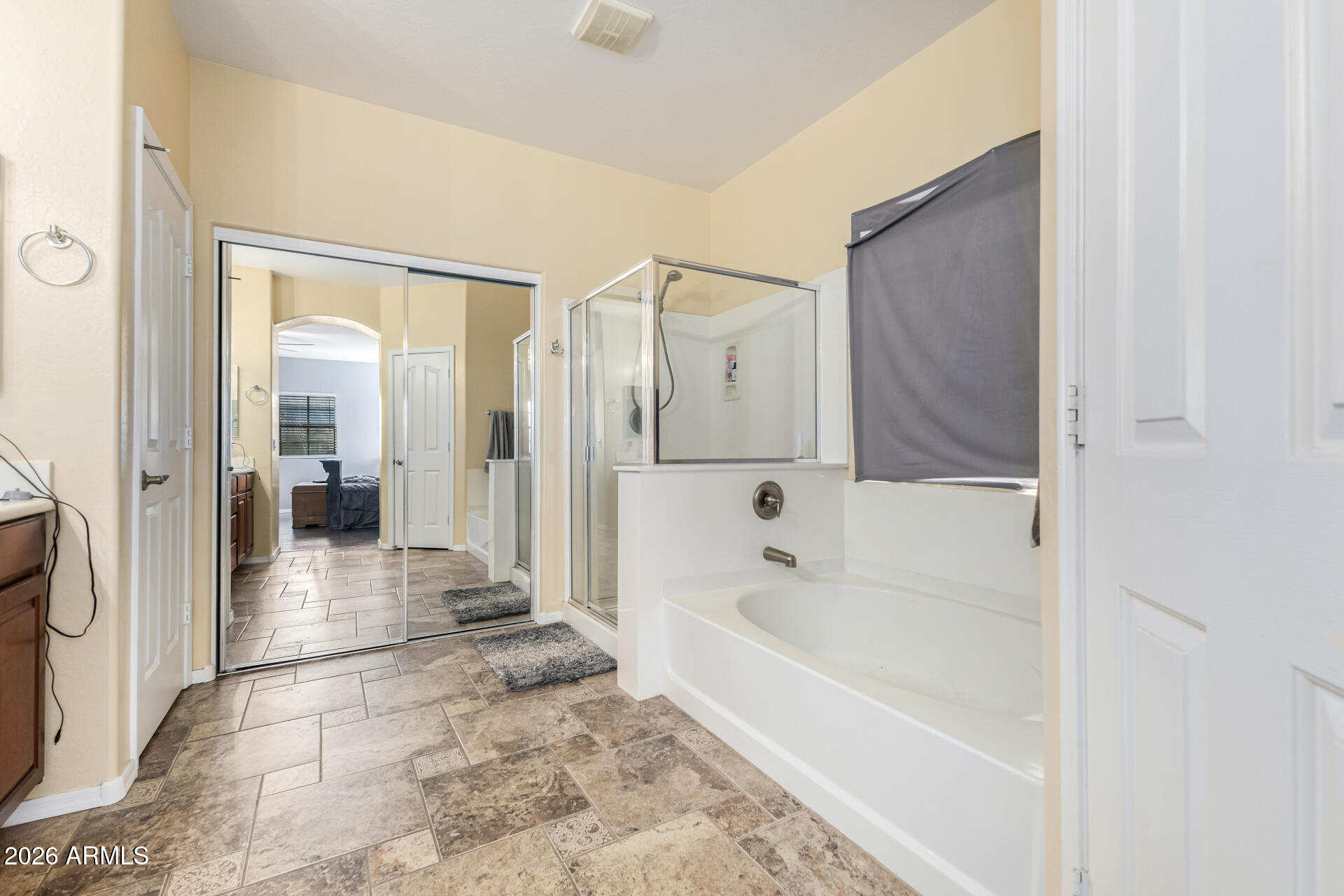 24541 Plum Road Florence, AZ 85132 - Photo 21 of 47 a bathroom with a bathtub and a shower