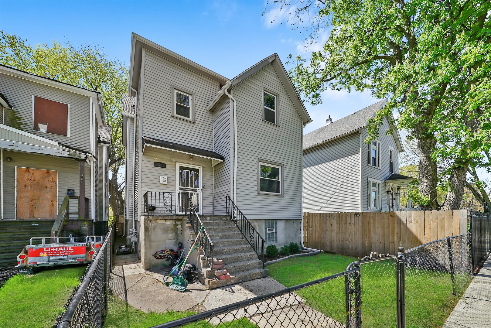 321 West 59th Place Chicago, IL 60621 - Photo 1 of 10 a front view of a house with garden
