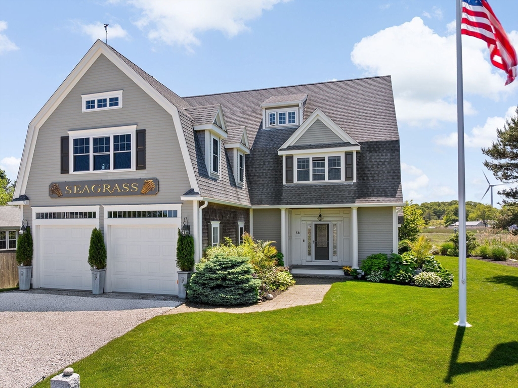 38 Gilson Road Scituate, MA 02066 - Photo 2 of 42 a front view of a house with a yard and garage