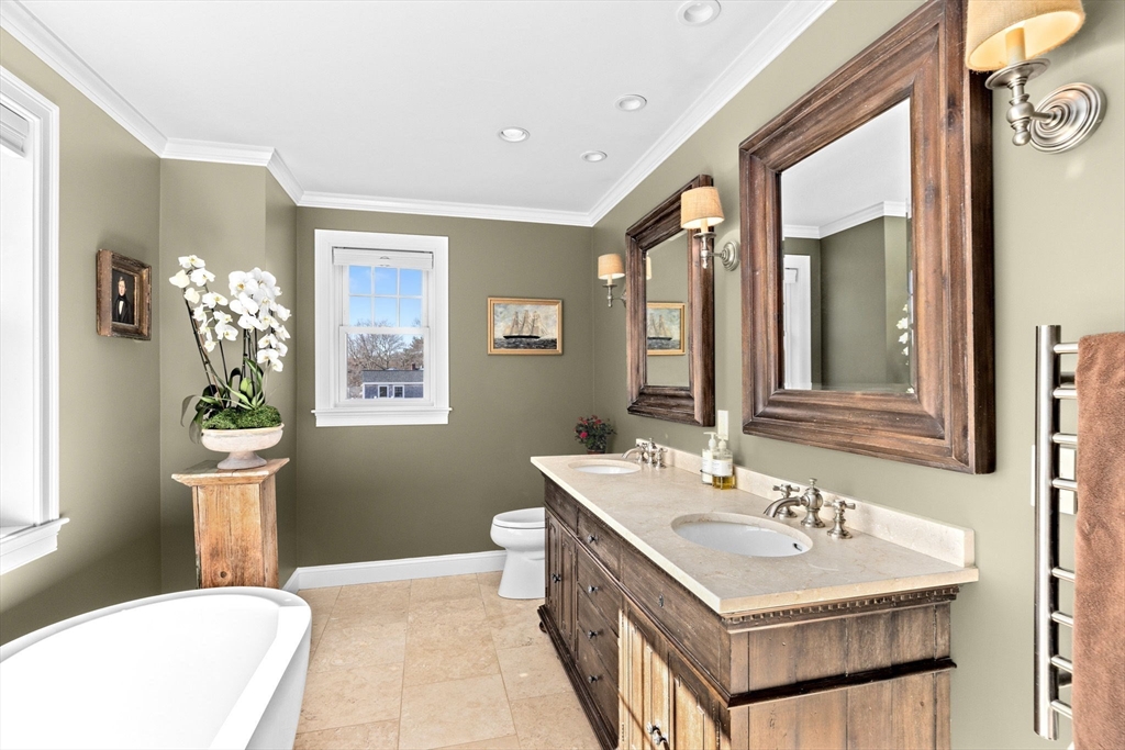 38 Gilson Road Scituate, MA 02066 - Photo 21 of 42 a bathroom with a sink and a mirror