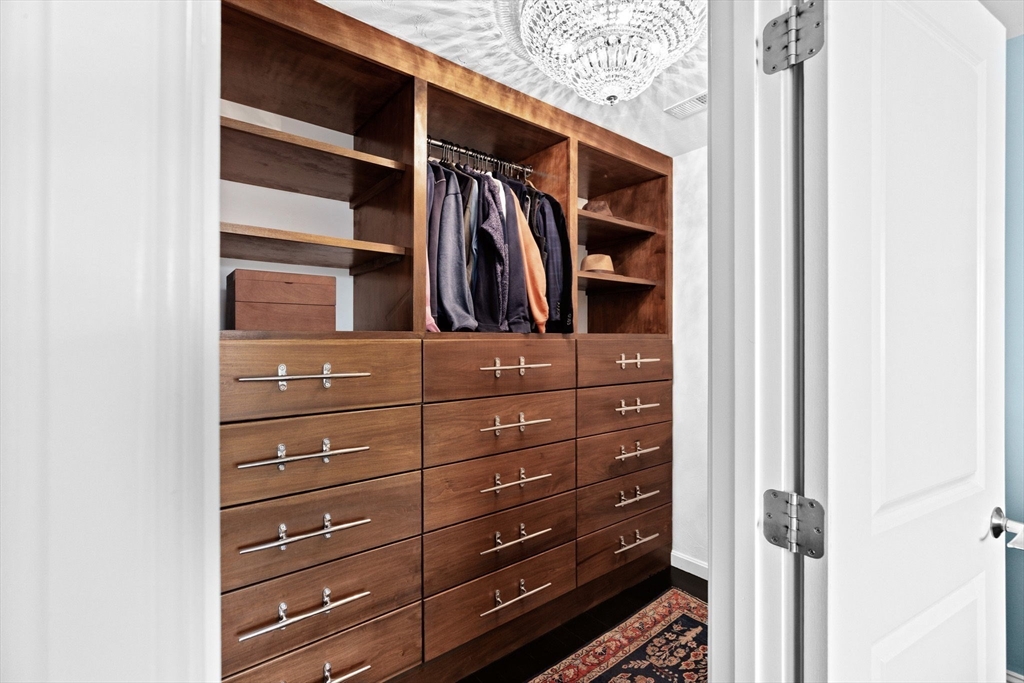 38 Gilson Road Scituate, MA 02066 - Photo 23 of 42 a view of walk in closet with clothes