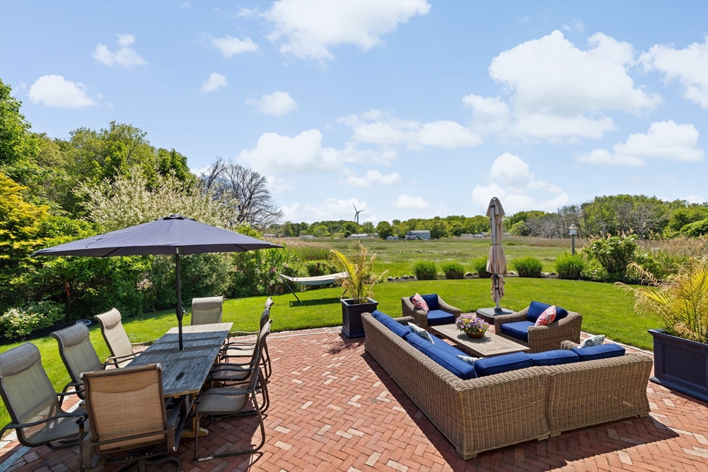 38 Gilson Road Scituate, MA 02066 - Photo 38 of 42 an outdoor sitting area with furniture and garden view