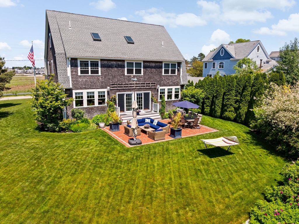 38 Gilson Road Scituate, MA 02066 - Photo 41 of 42 a front view of house with yard and outdoor seating