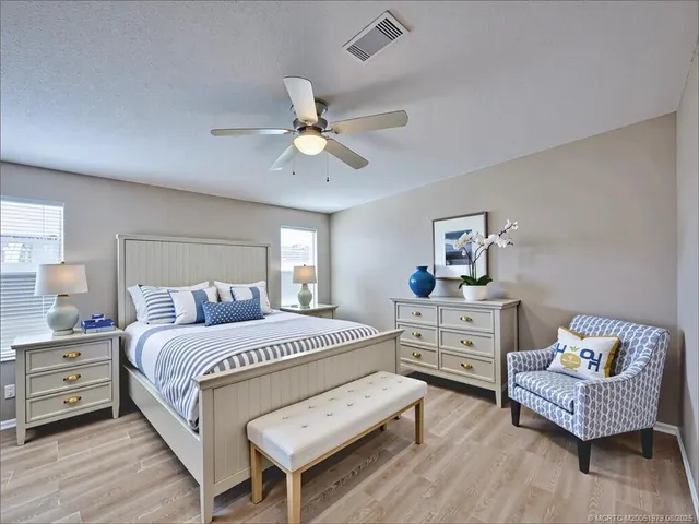 a bedroom with a bed and a couch