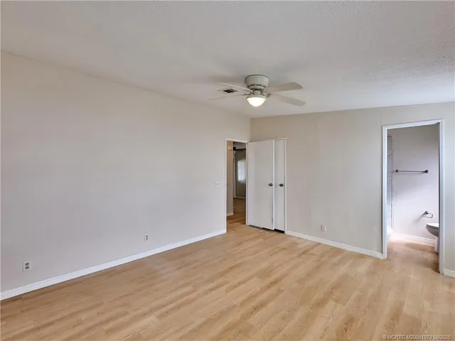 a view of an empty room with a bathroom