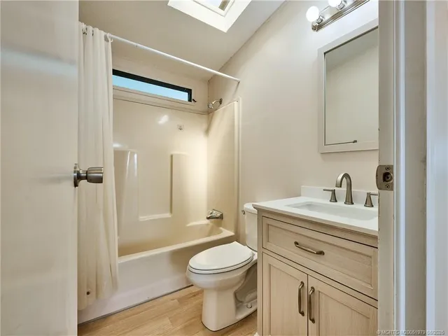 a bathroom with a toilet a sink and a bathtub