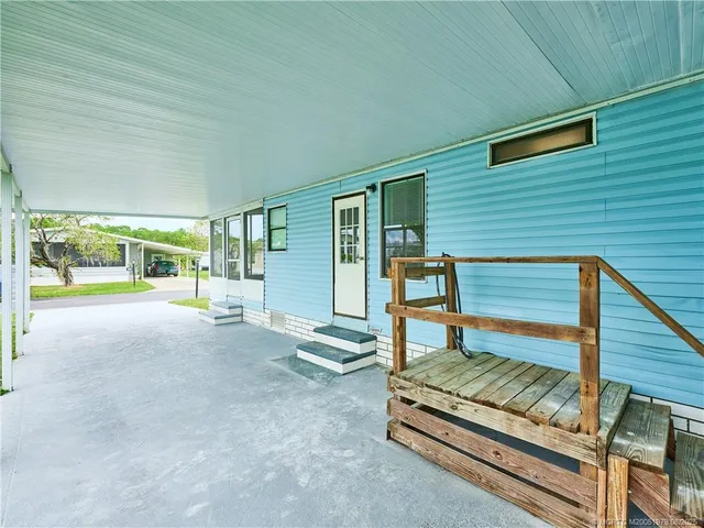 a bedroom with furniture and window