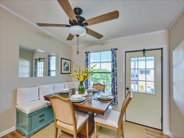 a view of a dining room with furniture window and outside view