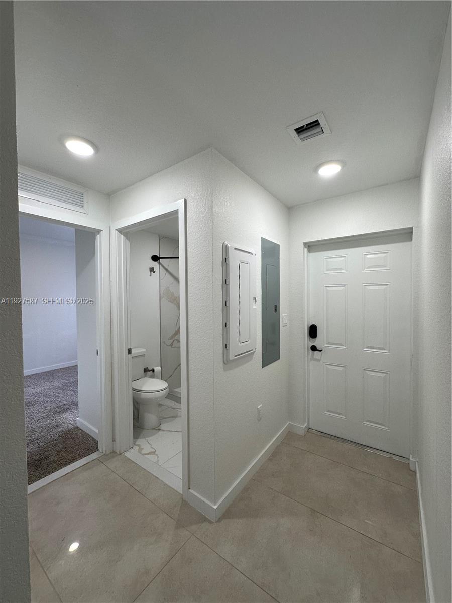 14573 Southwest 261st Terrace, Unit 14573 Homestead, FL 33032 - Photo 11 of 35 a bathroom with a shower and a sink