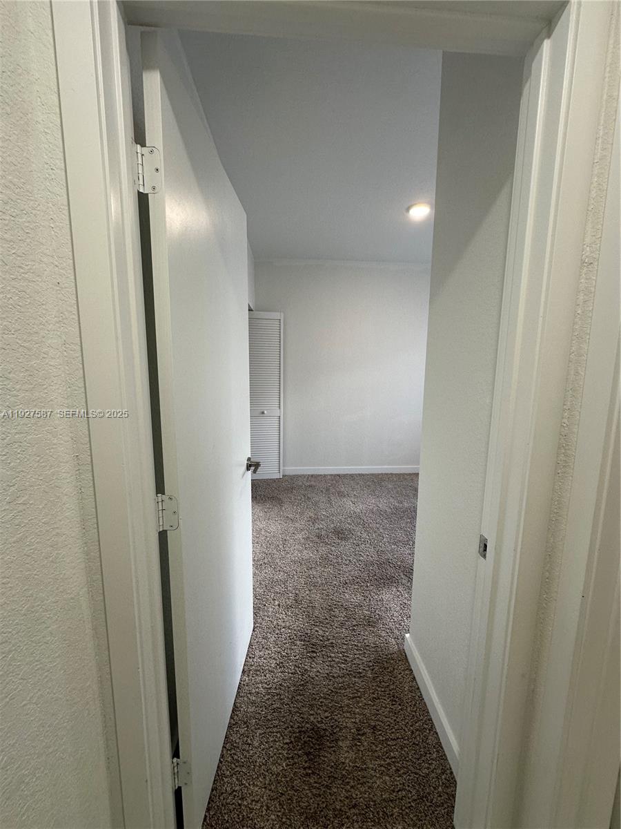 14573 Southwest 261st Terrace, Unit 14573 Homestead, FL 33032 - Photo 13 of 35 a view of hallway
