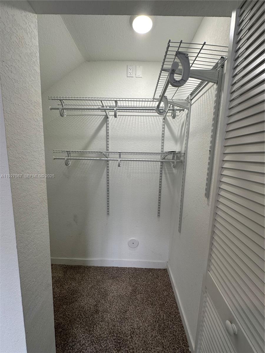 14573 Southwest 261st Terrace, Unit 14573 Homestead, FL 33032 - Photo 15 of 35 a view of a garage